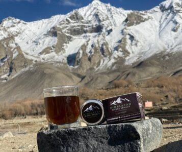 ELASNA™ Himalayan Shilajit resin placed in high-altitude Gilgit-Baltistan mountains
