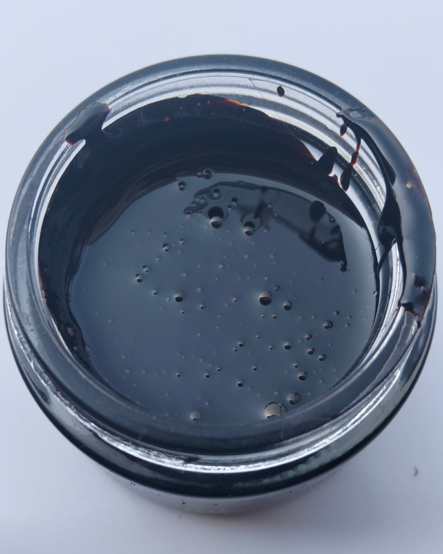 Top view of Elasna Himalayan Shilajit resin jar showing pure black Gold Grade Shilajit sourced from Gilgit Baltistan mountains