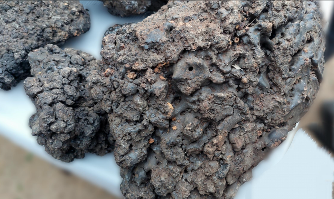 Close-up of Gold Grade sun-dried Pure Himalayan Shilajit resin sourced from Gilgit-Baltistan mountains for wholesale and OEM export supply