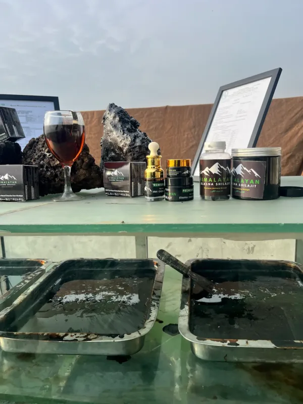 Elasna Himalayan Shilajit processing trays with resin purification and finished product jars display